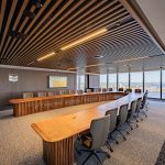 Custom Boardroom Table L9200 x W5000 in Australian Blackwood with integrated power and data. Compliant with strict human factors guidelines. Location- One The Esplanade, Elizabeth Quay, Perth Western Australia